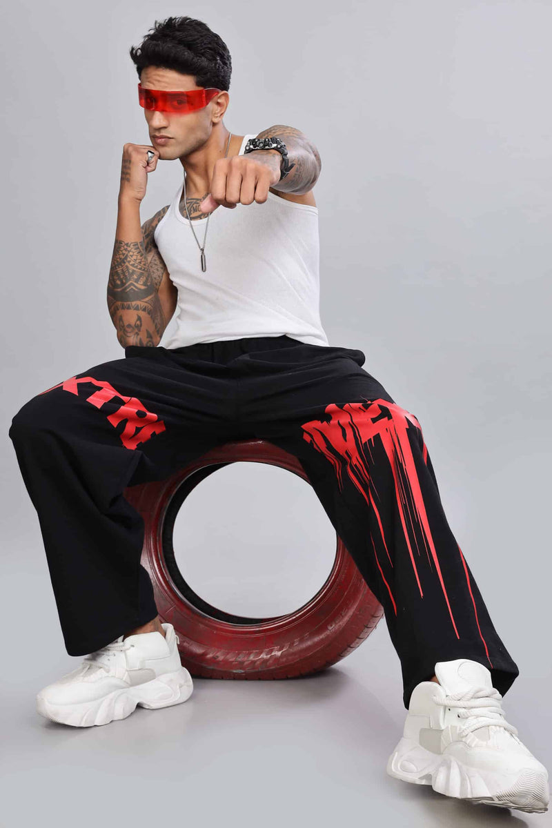 Comfortable streetwear joggers featuring artistic red drip pattern