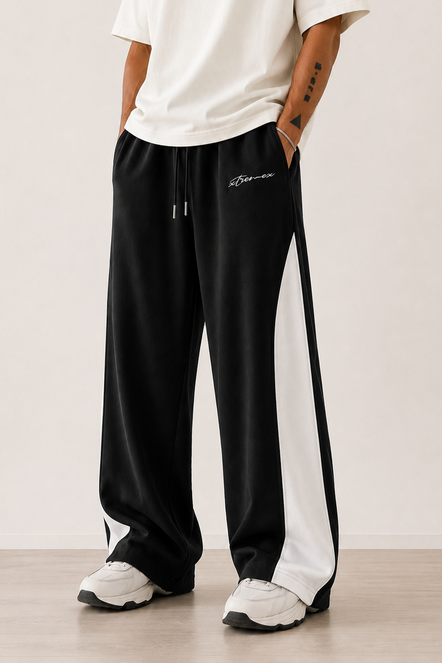 Black joggers featuring contrast side panel design