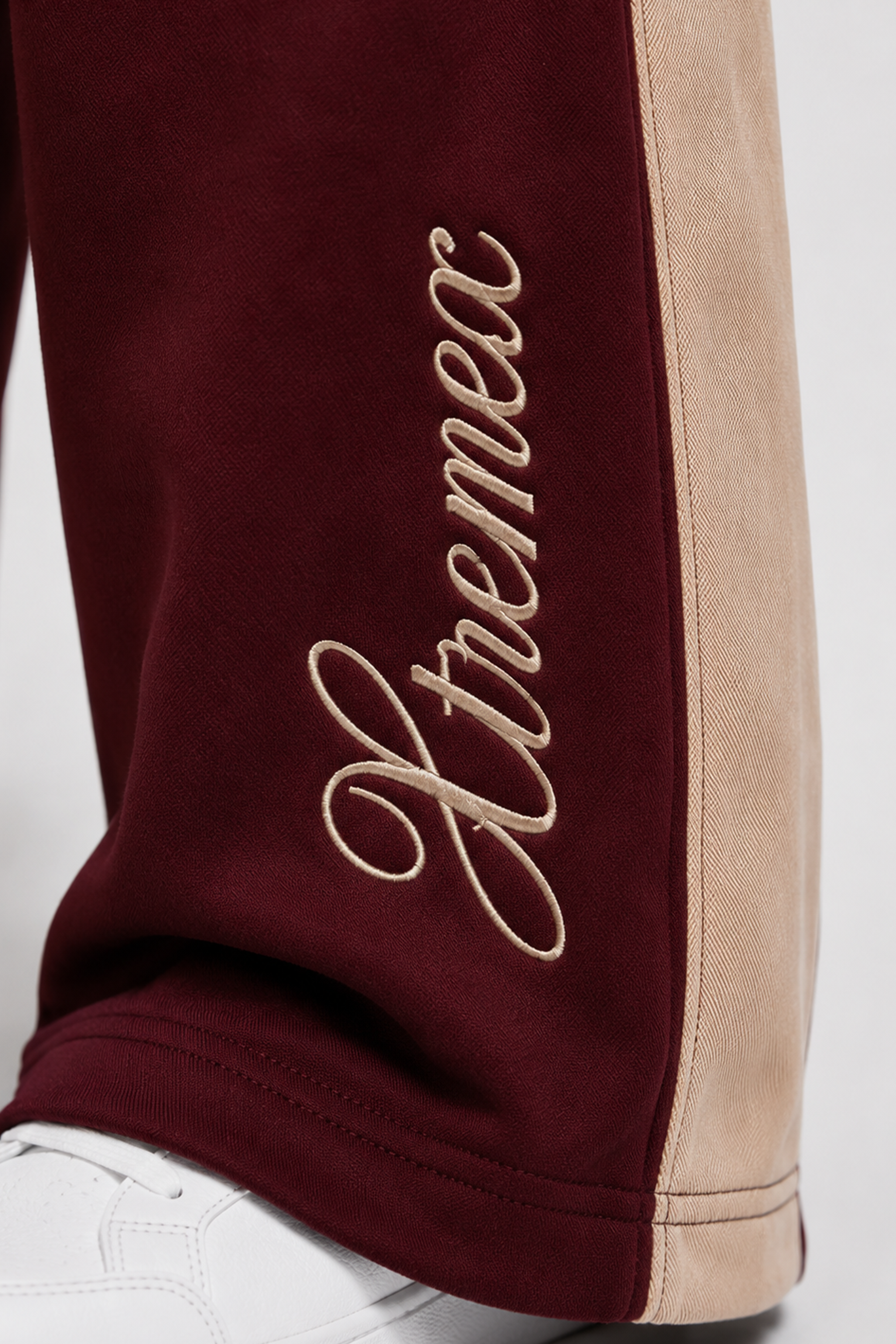 Image of Maroon oversized joggers with embroidered logo detail