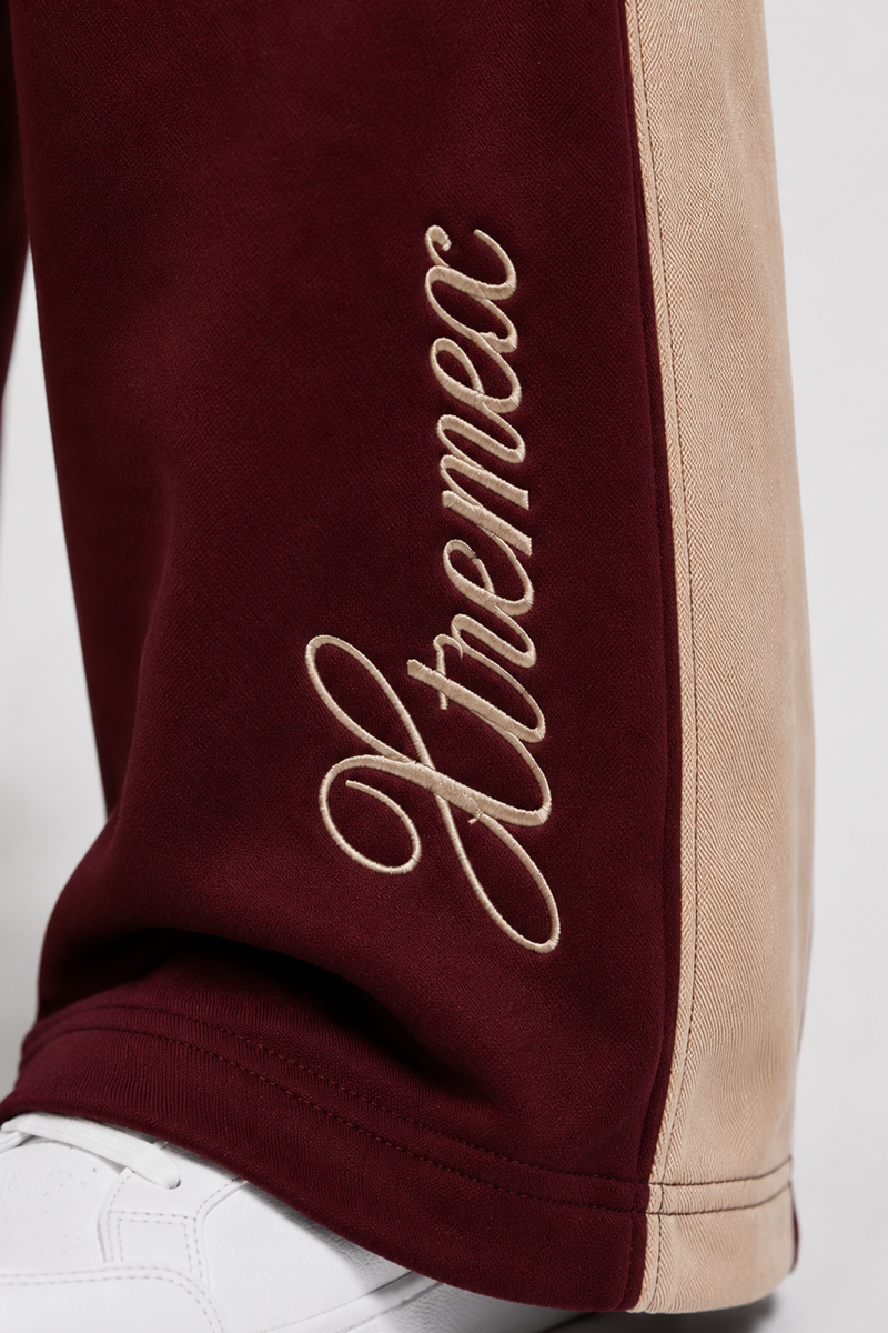 Maroon oversized joggers with embroidered logo detail