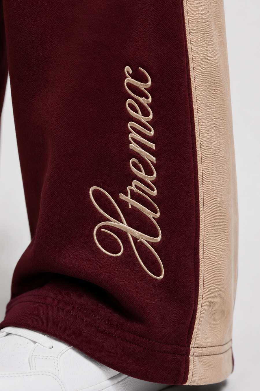 Maroon oversized joggers with embroidered logo detail