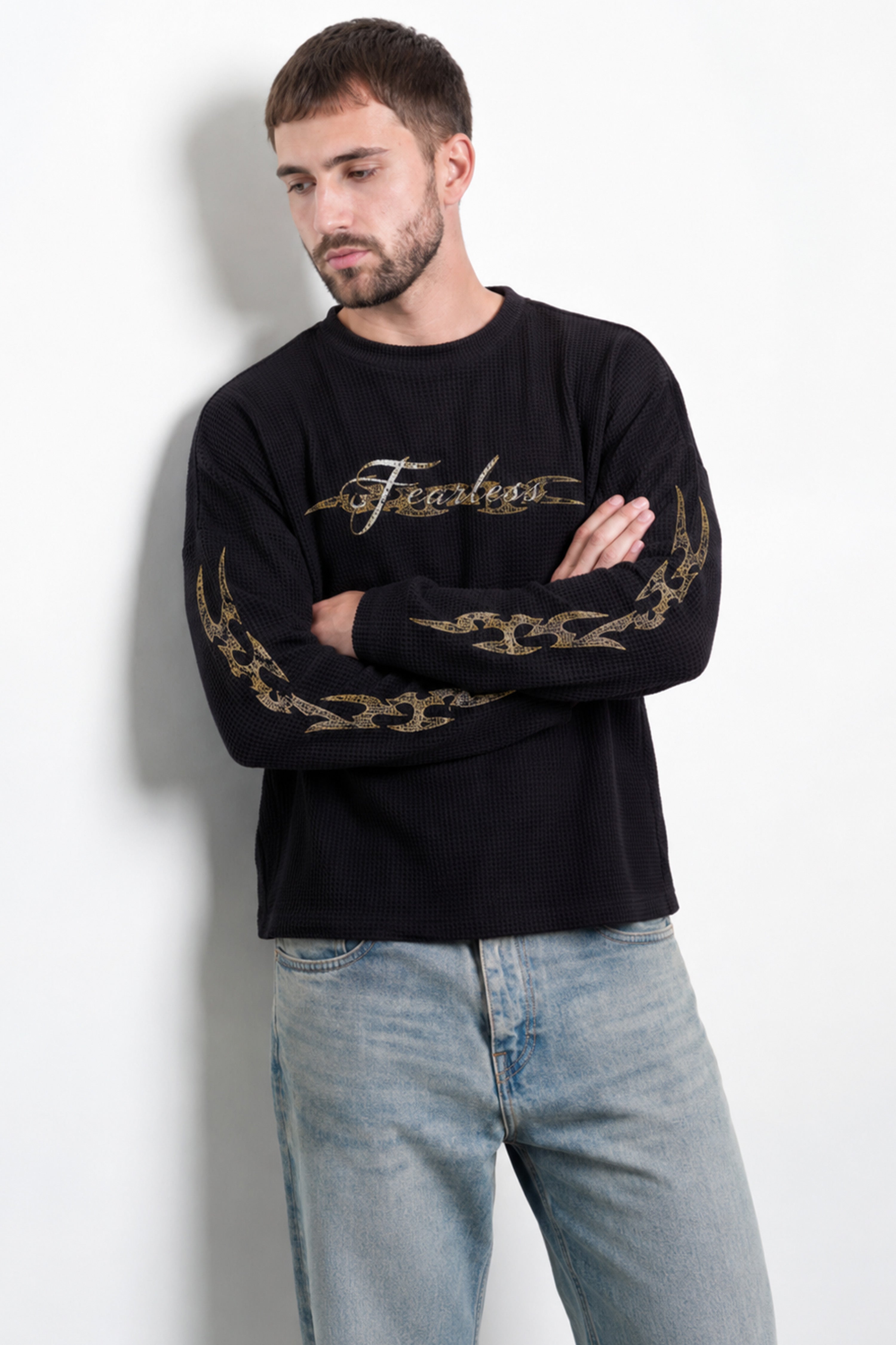 Image of Men's Fearless Waffle Tshirt Black featuring chest logo and sleeve graphics