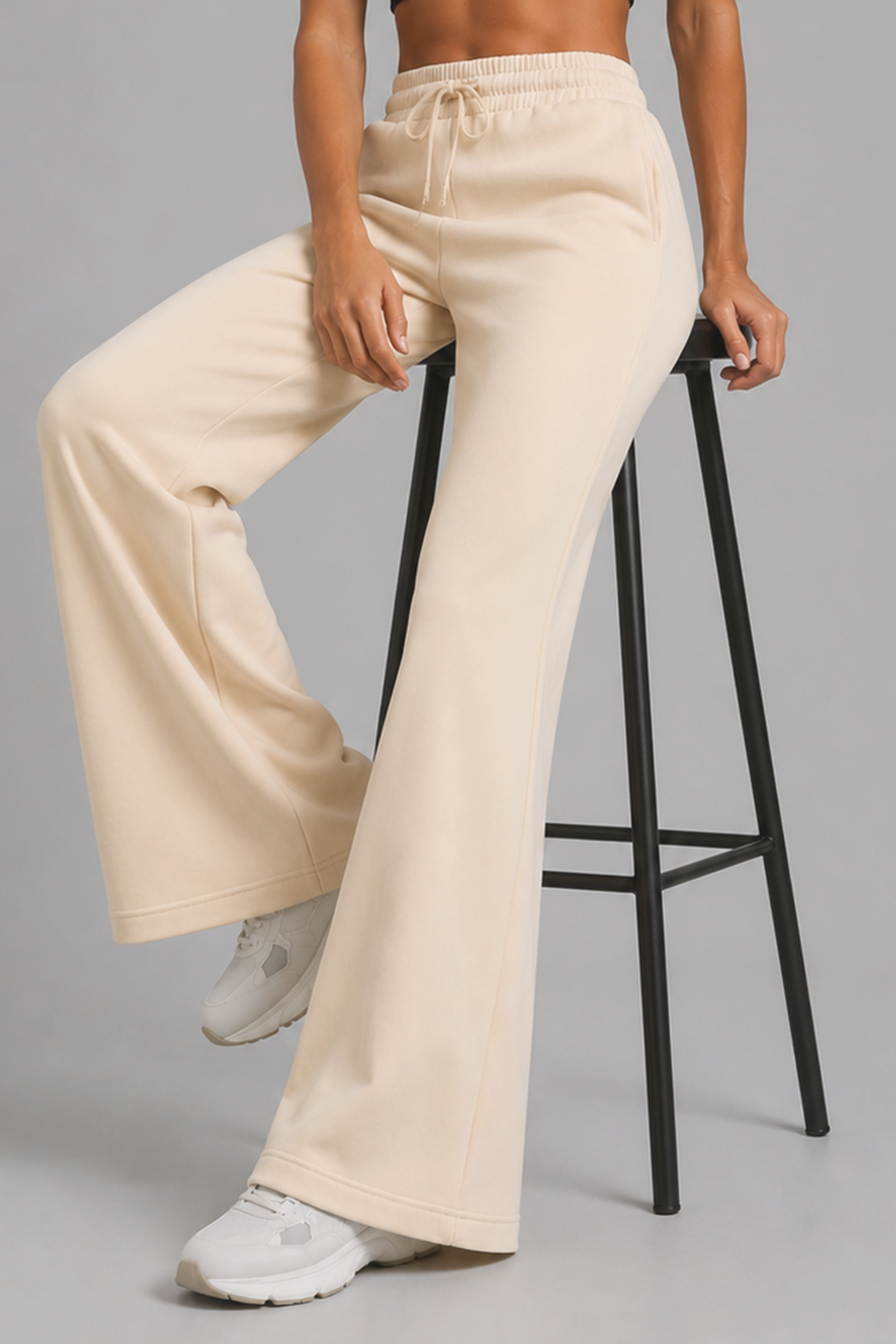 Image of Beige flared pants for everyday comfort and movement
